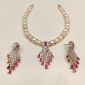 Price: 4600/- Natural fresh water pearl necklace Discover the timeless elegance of Magan Pearls' exquisite jewelry sets! Each set features a stunning pearl necklace paired with matching drop earrings. Design Variety Quality Craftsmanship Complete Set Contact Us: +91 9866972230 or visit us at 5-8-742/A, Ground Floor, Chapel Rd, opposite UDAI OMNI Hospital, Abids, Hyderabad, Telangana.
