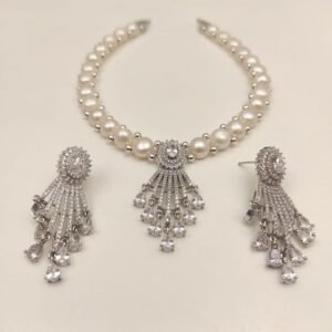 Price: 4600/- Natural fresh water pearl necklace Discover the timeless elegance of Magan Pearls' exquisite jewelry sets! Each set features a stunning pearl necklace paired with matching drop earrings. Design Variety Quality Craftsmanship Complete Set Contact Us: +91 9866972230 or visit us at 5-8-742/A, Ground Floor, Chapel Rd, opposite UDAI OMNI Hospital, Abids, Hyderabad, Telangana.